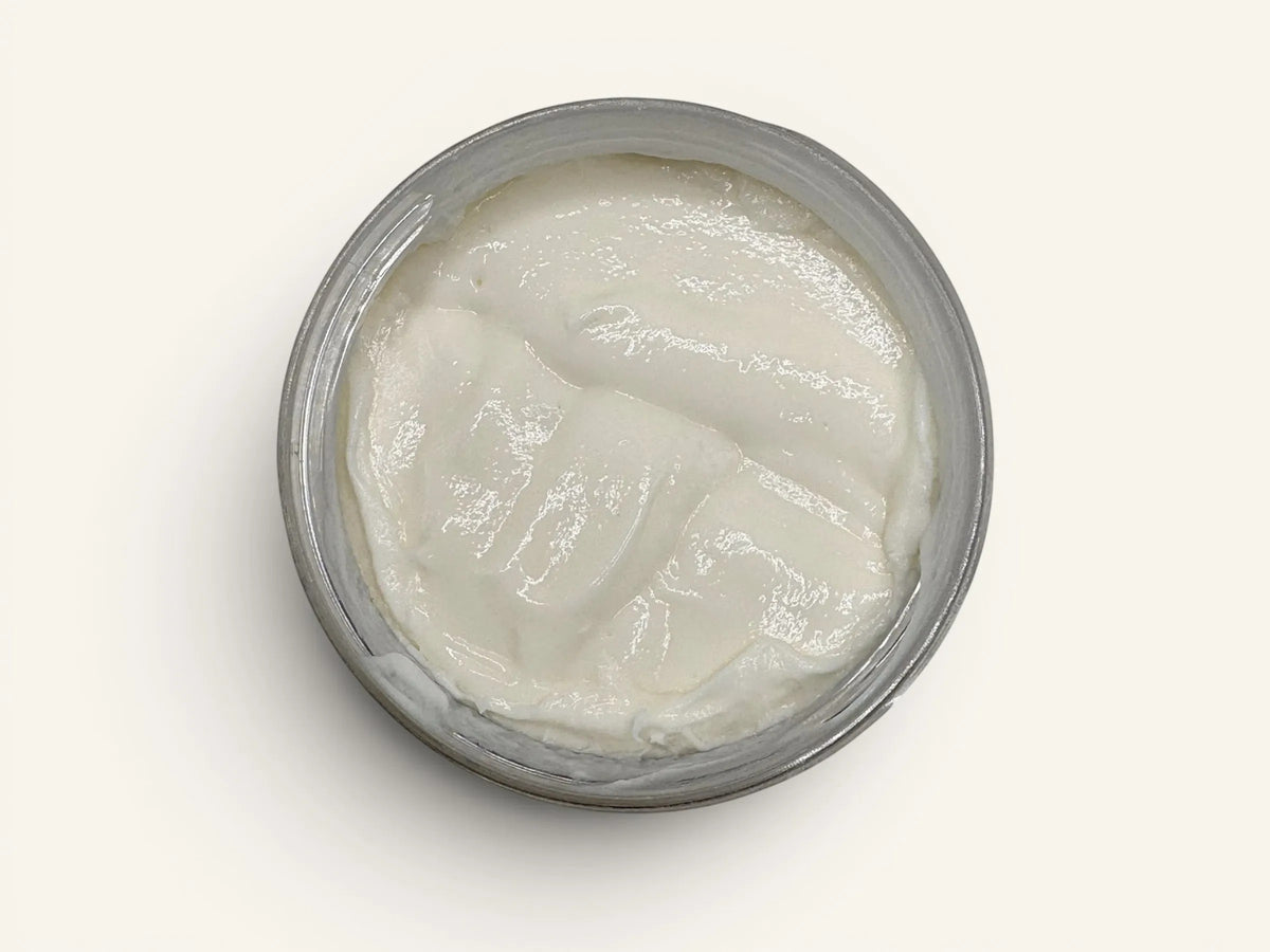 Velvet Bath Bar Caribbean Teakwood Velvet Luxe Body Butter in a silver jar, creamy white texture.