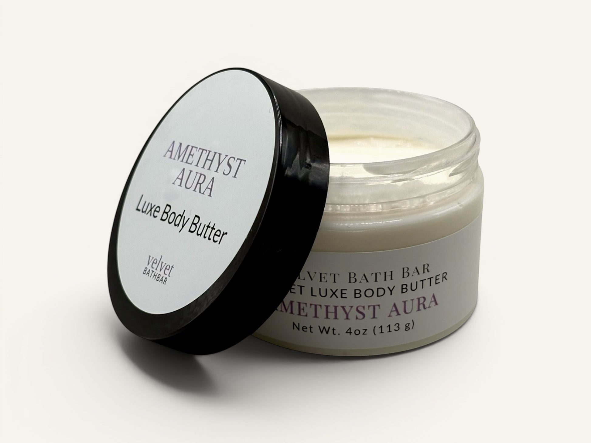 Velvet Bath Bar Amethyst Aura Luxe Body Butter in a clear jar with a black lid. Calming and spa-like.