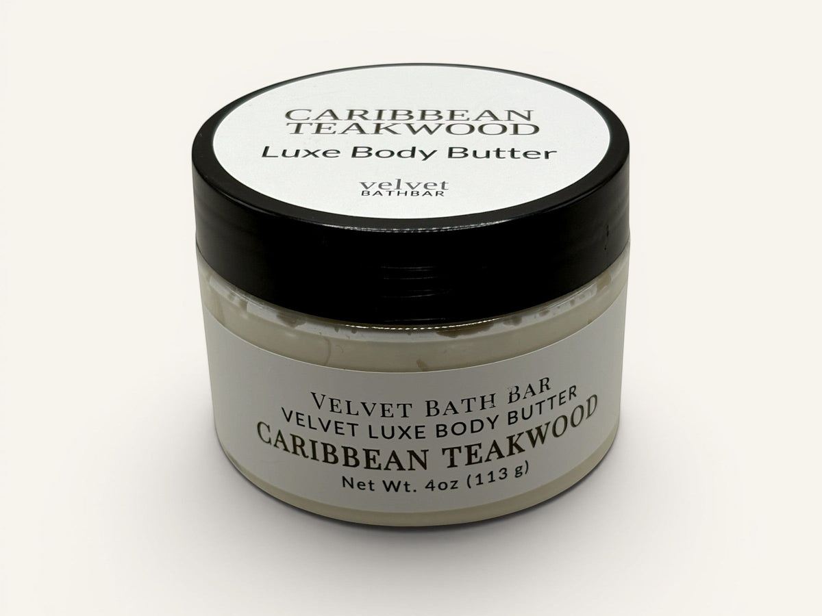 Velvet Bath Bar Caribbean Teakwood Luxe Body Butter in a clear jar with a black lid. Net Wt. 4oz.