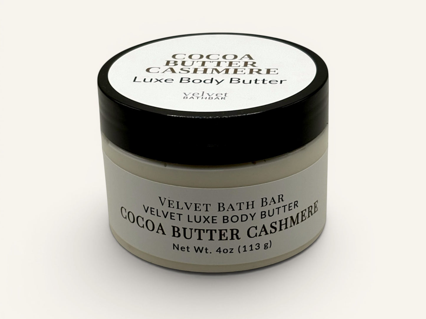 Velvet Bath Bar Cocoa Butter Cashmere Luxe Body Butter in a white jar with a black lid. 4oz.