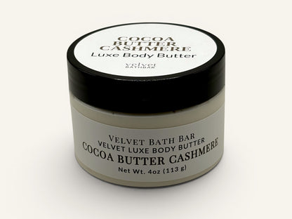 Velvet Bath Bar Cocoa Butter Cashmere Luxe Body Butter in a white jar with a black lid. 4oz.