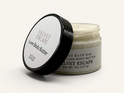 Velvet Bath Bar Velvet Escape Luxe Body Butter in a clear jar with a black lid. Net Wt. 4oz.