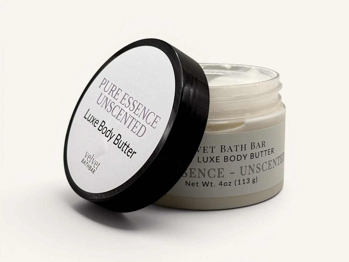 Velvet Bath Bar Pure Essence Luxe Body Butter in a clear jar with a black lid. Unscented formula for sensitive skin.