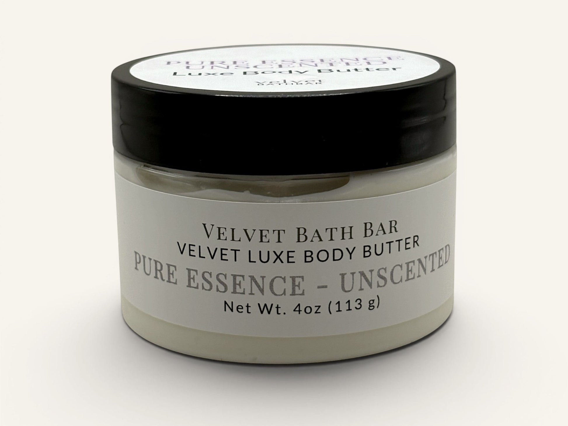 Velvet Bath Bar Pure Essence Unscented Velvet Luxe Body Butter in a clear jar with a black lid. Net Wt. 4oz.